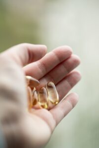 A person holding two rings in their hand